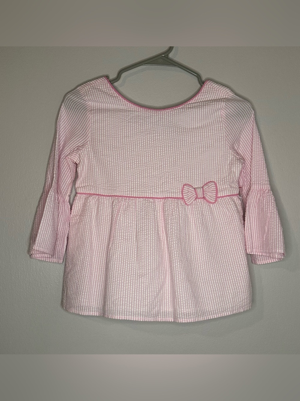 Pink Long-Sleeve Babydoll Top with Bow - Kids